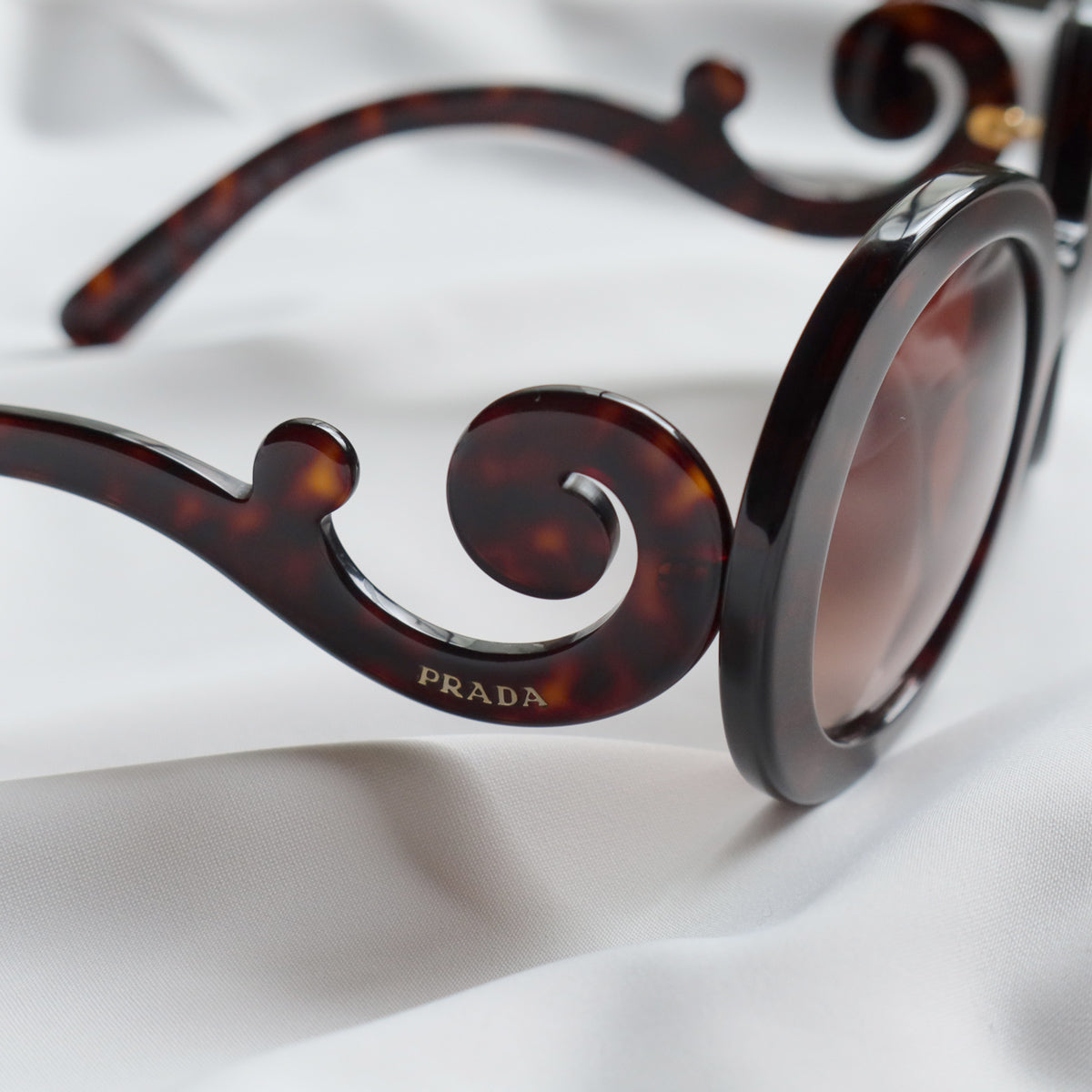 Prada Women Baroque Swirl Round Sunglasses in Havana Brown