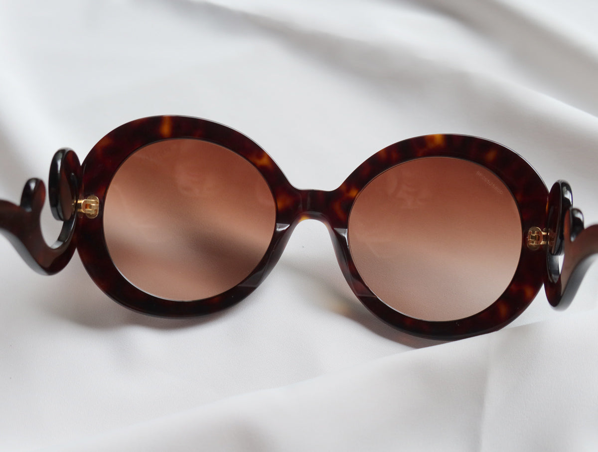 Prada Women Baroque Swirl Round Sunglasses in Havana Brown