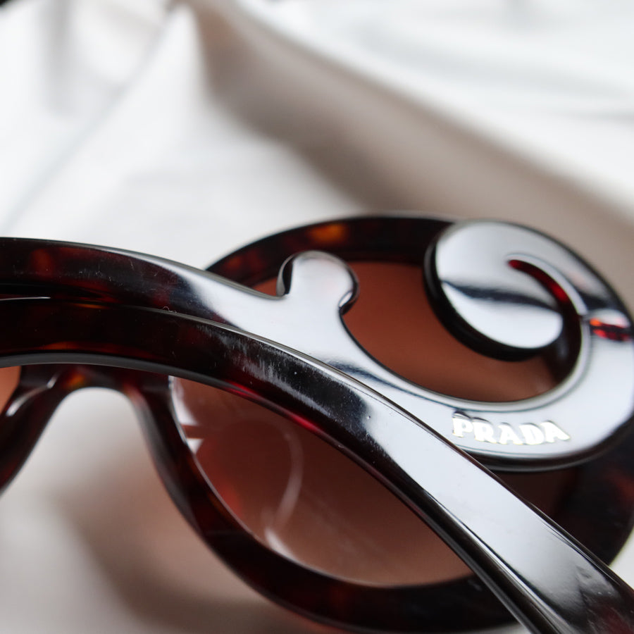 Prada Women Baroque Swirl Round Sunglasses in Havana Brown