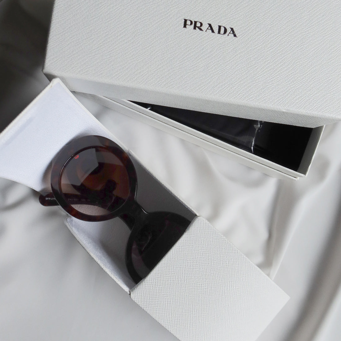 Prada Women Baroque Swirl Round Sunglasses in Havana Brown